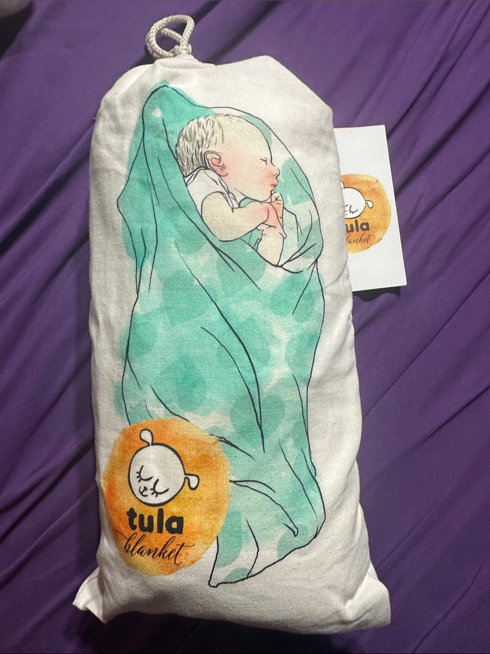 Tula baby blanket - teal and white with orange logo